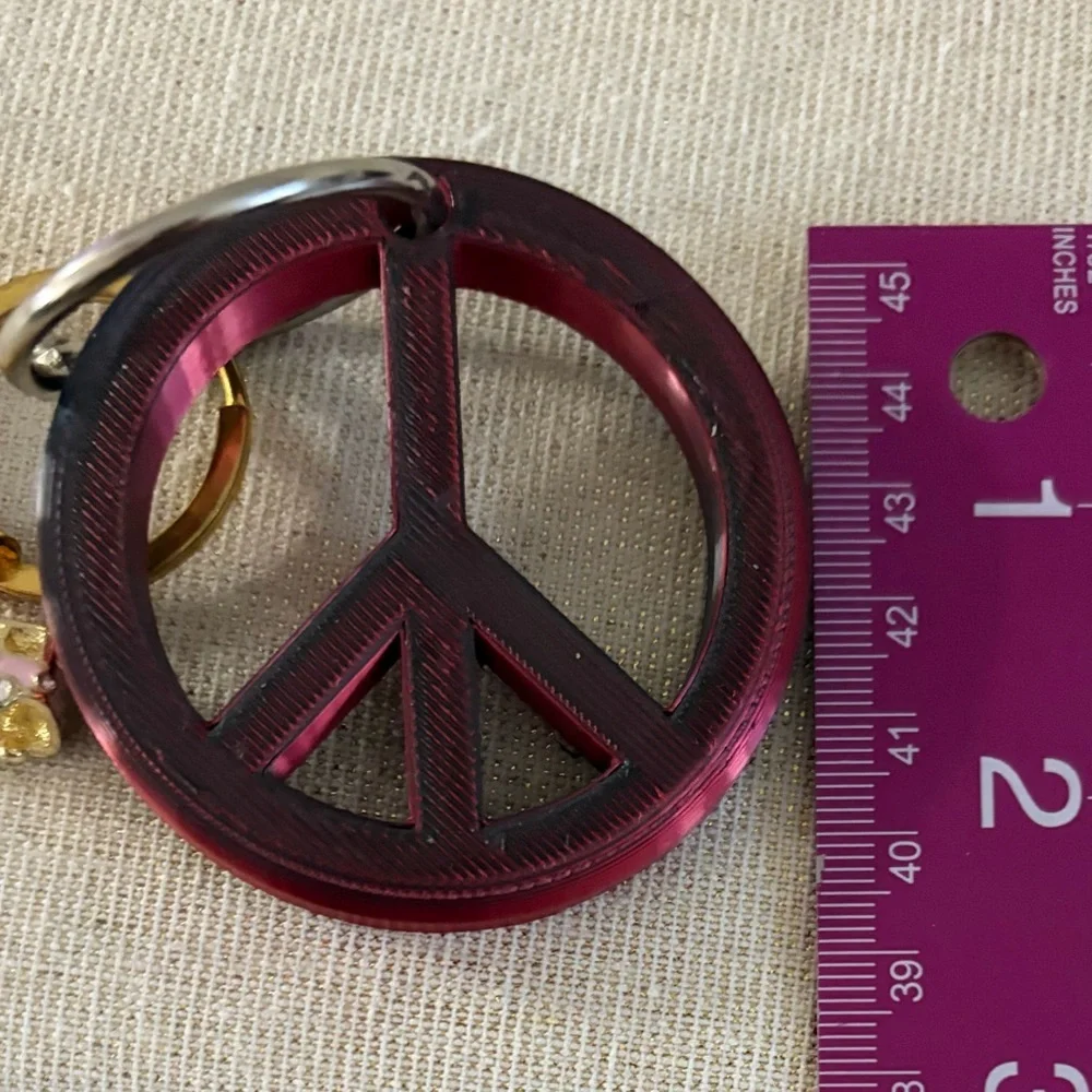 Gold Ring Keychain with Pink Bus Charm also peace sign keychain